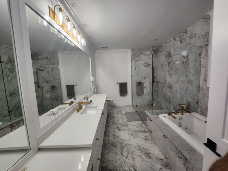 Luxury bathroom with light decor interiors and marble tiles